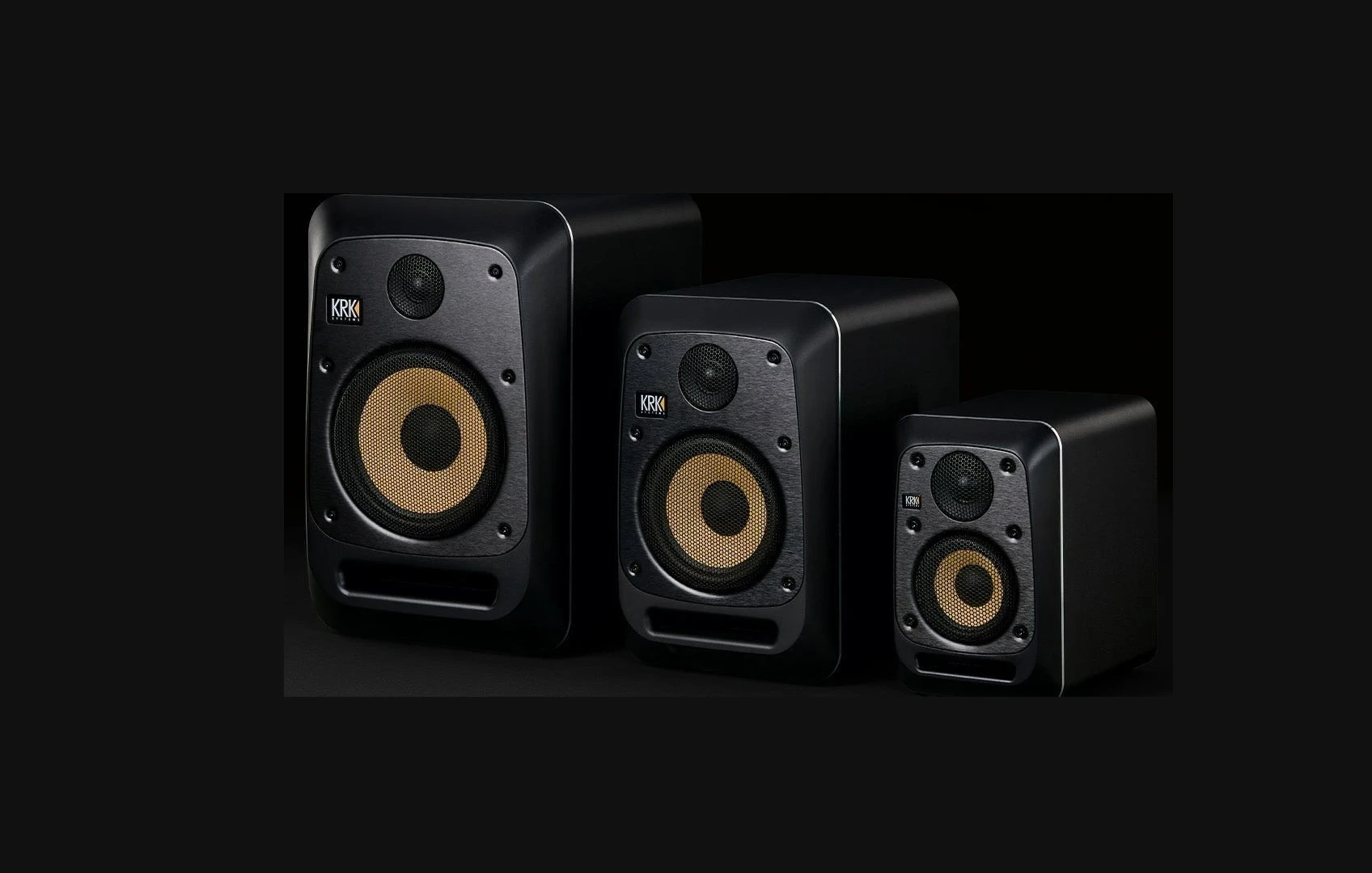 KRK V Series Five studio monitors in three sizes on a dark background