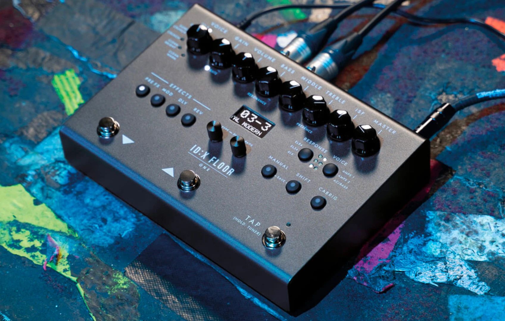 Blackstar ID:X Floor Three digital floorboard connected with cables on a colorful studio surface.